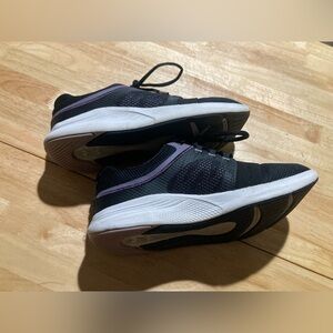 Under Armour sneakers in size 7.5 in EUC. Black & white with purple accents